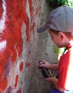 Asher spray painting his tag